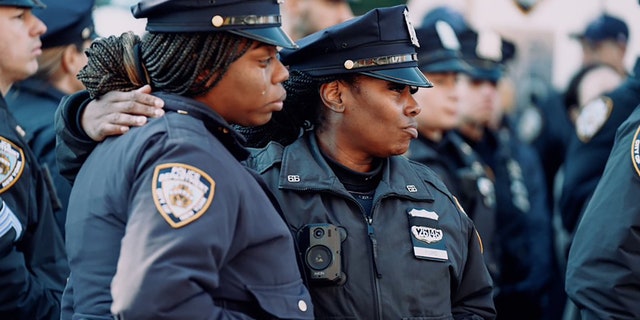 NYPD officers gathered outside the at the Makki Masjid Muslim Community Center in Brooklyn to pay their final respects to the fallen 26-year-old officer.