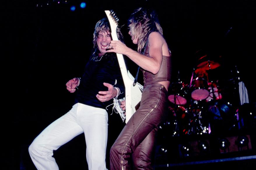 View of British Heavy Metal singer Ozzy Osbourne (left) and American musician Randy Rhoads (1956 - 1982), on guitar, as they perform, during the 'Blizzard of Ozz Tour,' at Nassau Coliseum, Uniondale, New York, August 14, 1981.