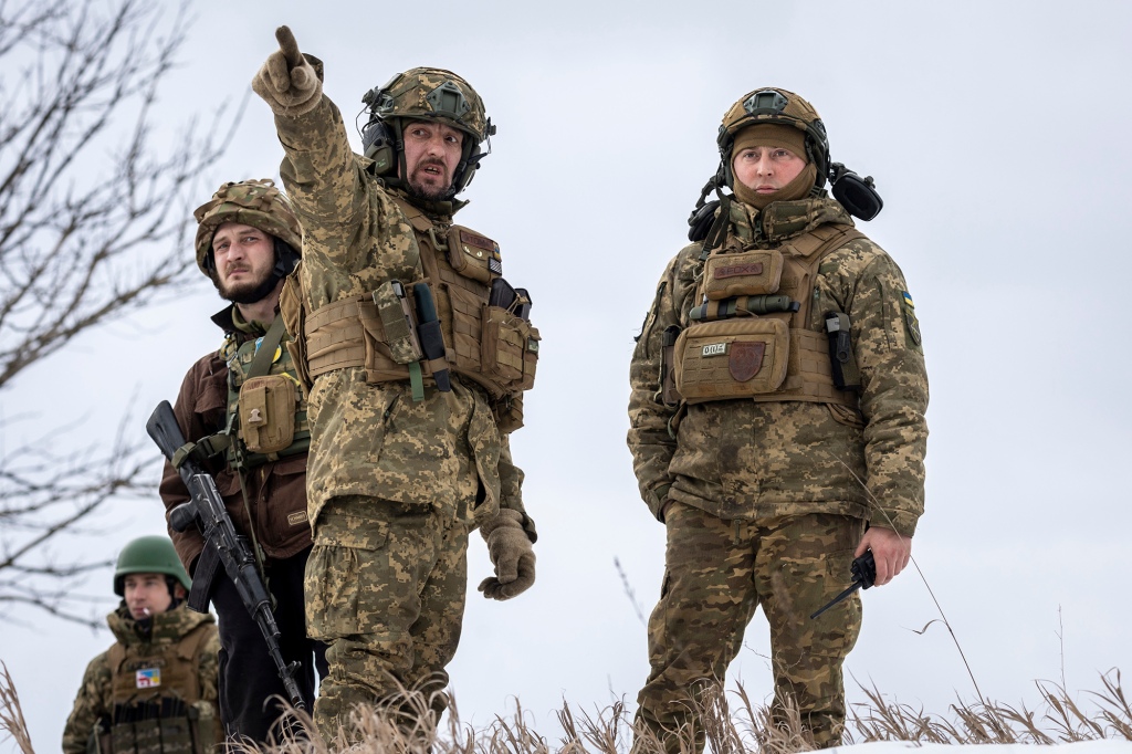 Ukrainian soldiers look towards Russian positions on February 14, 2023 near Bakhmut, Ukraine.