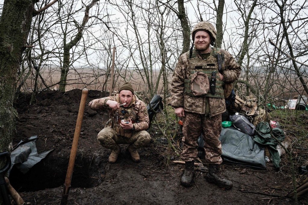 Ukrainian servicemen rest after digging a new shelter near a frontline position in the Donetsk region.