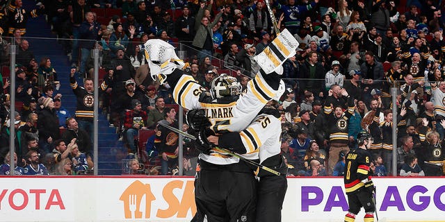 Linus Ullmark #35 of the Boston Bruins scores a goalie goal on a pulled net during the final seconds of their NHL game against the Vancouver Canucks at Rogers Arena February 25, 2023, in Vancouver, British Columbia, Canada. The Boston Bruins win 3-1.   