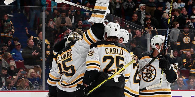 Linus Ullmark #35 of the Boston Bruins scores a goalie goal on a pulled net during the final seconds of their NHL game against the Vancouver Canucks at Rogers Arena February 25, 2023, in Vancouver, British Columbia, Canada. The Boston Bruins win 3-1.   