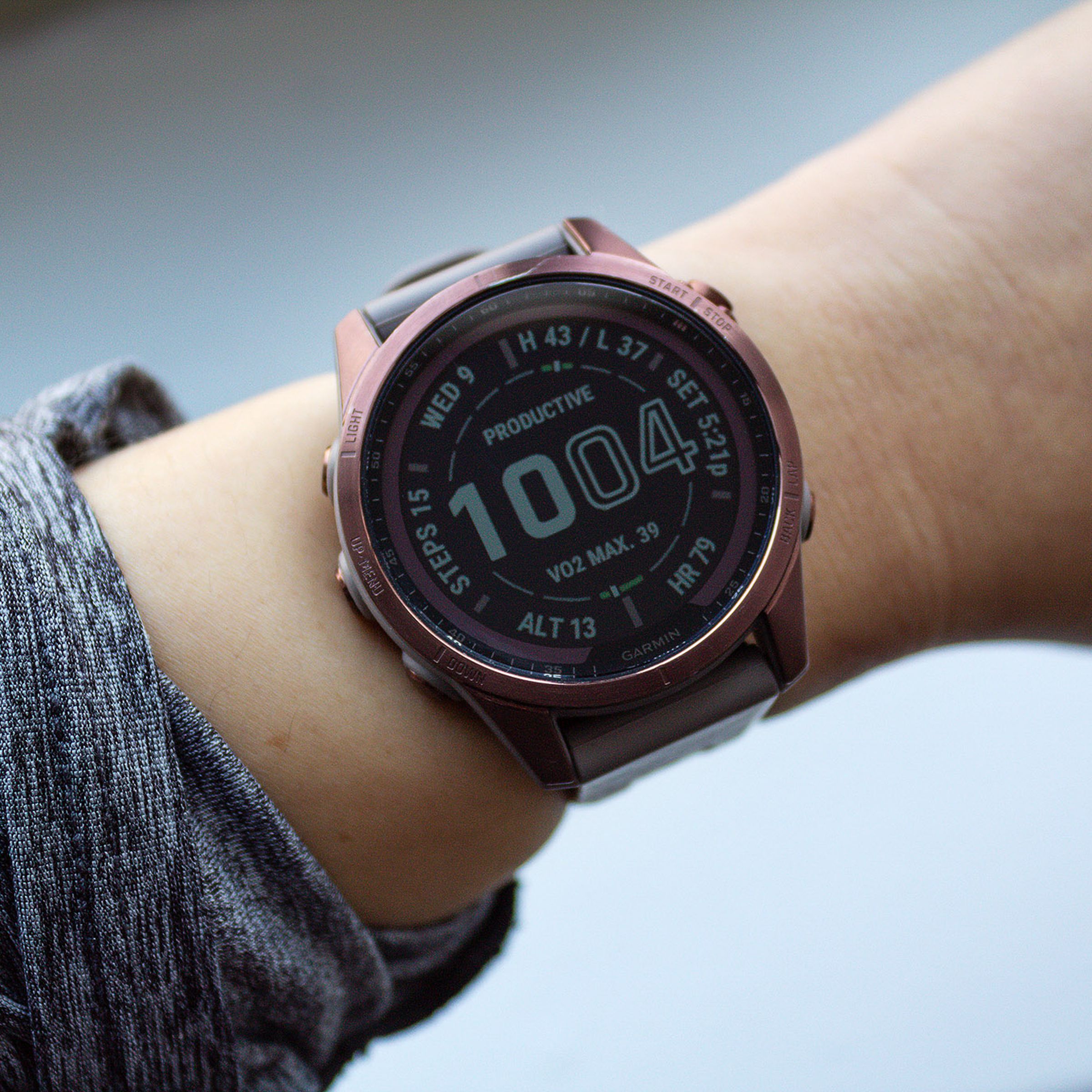 The Garmin Fenix 7S on a wrist.