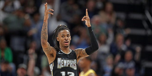 Ja Morant, #12 of the Memphis Grizzlies, reacts during the game against the Los Angeles Lakers at FedExForum on February 28, 2023, in Memphis, Tennessee.  