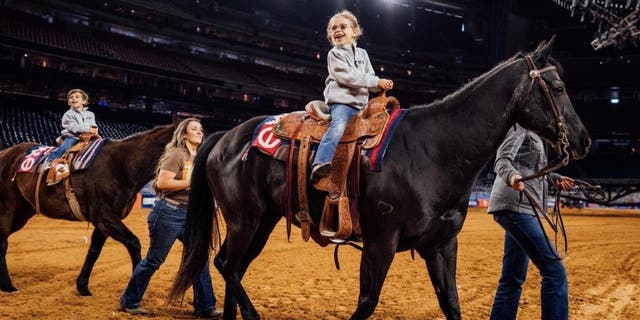 Casey DeSantis and her two children, Madison and Mason at the Houston Livestock Show and Rodeo on Friday, March 3, 2023.