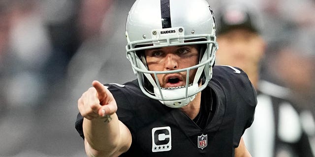 Derek Carr of the Raiders reacts at the line of scrimmage during the New England Patriots game at Allegiant Stadium on Dec. 18, 2022, in Las Vegas.