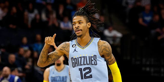 Ja Morant of the Memphis Grizzlies celebrates a 3-point basket against the Minnesota Timberwolves in the first quarter of a game at Target Center Nov. 30, 2022, in Minneapolis. 