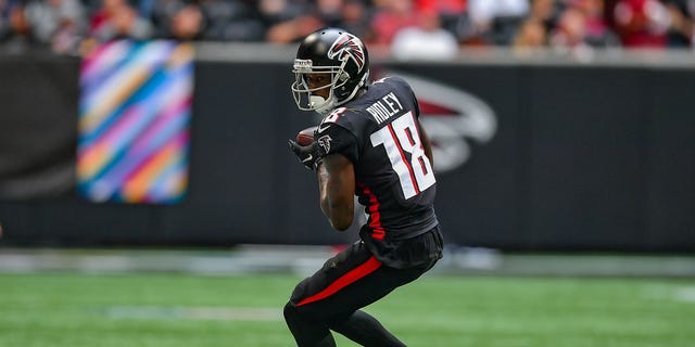 Atlanta wide receiver Calvin Ridley (18) turns upfield after catching a pass during the NFL game between the Washington Football Team and the Atlanta Falcons on October 3rd, 2021 at Mercedes-Benz Stadium in Atlanta, GA.