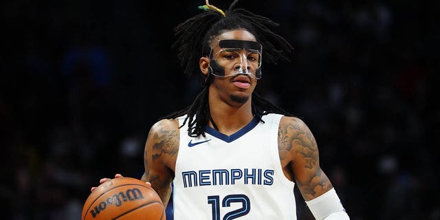 Memphis Grizzlies guard Ja Morant, #12, dribbles during the first quarter against the Denver Nuggets at Ball Arena in Denver March 3, 2023.