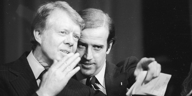 Delaware U.S. Sen. Joseph Biden points out a friend in the crowd at the Padua Academy to President Jimmy Carter during a fundraiser. 