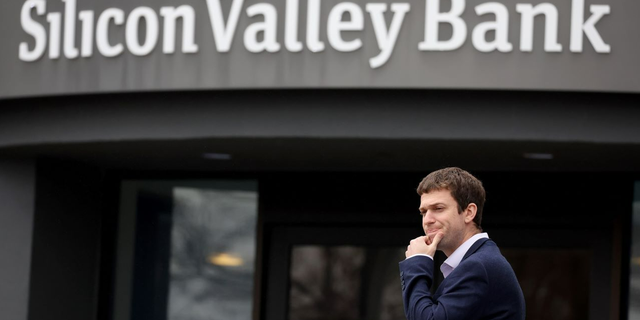 A customer stands outside of a shuttered Silicon Valley Bank (SVB) headquarters on March 10, 2023 in Santa Clara, California. Silicon Valley Bank was shut down on Friday morning by California regulators and was put in control of the U.S. Federal Deposit Insurance Corporation.