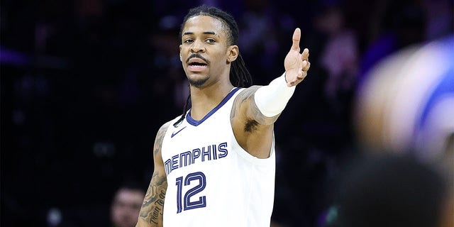 Ja Morant #12 of the Memphis Grizzlies reacts during the second quarter against the Philadelphia 76ers at Wells Fargo Center on February 23, 2023 in Philadelphia, Pennsylvania. 