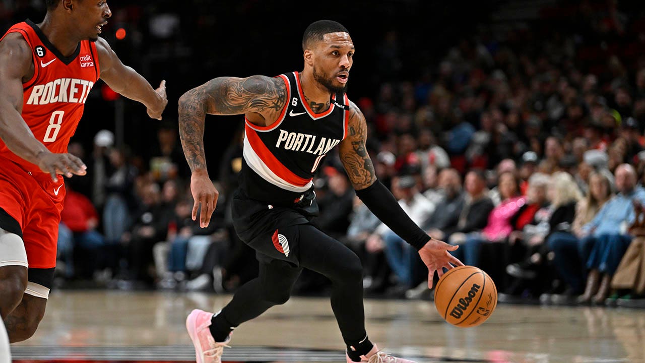 Damian Lillard drives the ball down court against the Rockets