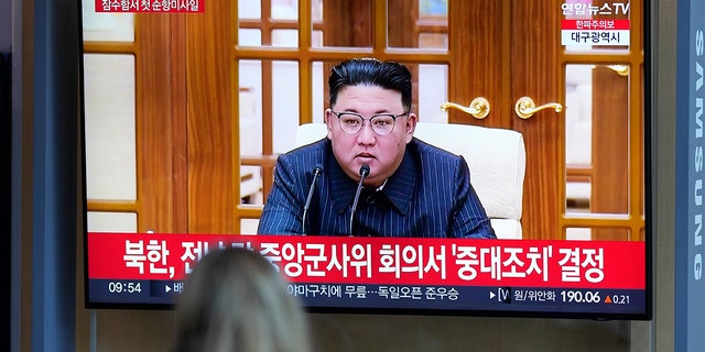 A TV screen shows an image of North Korean leader Kim Jong Un at the Seoul Railway Station in South Korea.