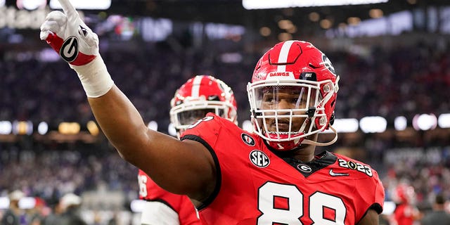 FILE - Georgia defensive lineman Jalen Carter (88) waves to the crowd before the national championship NCAA College Football Playoff game between Georgia and TCU, Monday, Jan. 9, 2023, in Inglewood, Calif.