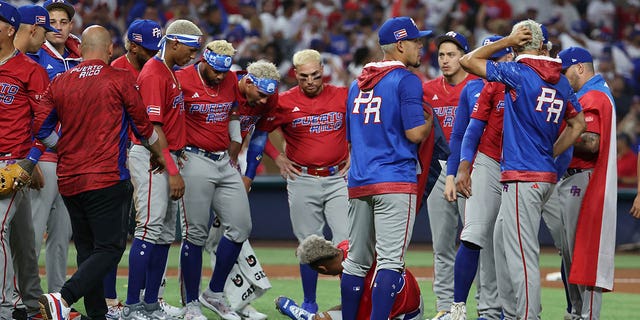 Edwin Diaz, #39 of Team Puerto Rico, lies hurt on the field after celebrating a 5-2 win against Team Dominican Republic during their World Baseball Classic Pool D game at loanDepot park on March 15, 2023 in Miami.