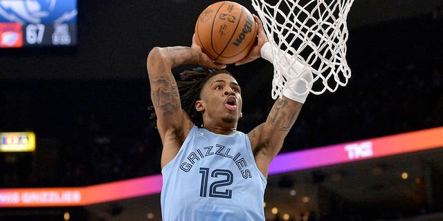 Memphis Grizzlies guard Ja Morant goes up for a dunk during the second half of the game against the New Orleans Pelicans in Memphis, Tennessee, on March 8, 2022.