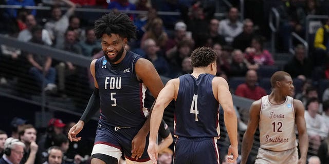 Ansley Almonor, #5 of the Fairleigh Dickinson Knights, celebrates after his made basket with Grant Singleton #4 against the Texas Southern Tigers during the second half in the First Four game of the NCAA Men's Basketball Tournament at University of Dayton Arena on March 15, 2023, in Dayton, Ohio. 