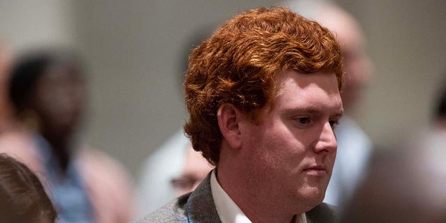 Buster Murdaugh, the son of Alex Murdaugh, stands in the courtroom after his father Alex Murdaugh is found guilty on all counts for the murder of his wife and son at the Colleton County Courthouse on Thursday, March 2, 2023.