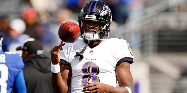 Lamar Jackson, #8 of the Baltimore Ravens, warms up prior to the game against the New York Giants at MetLife Stadium on Oct. 16, 2022 in East Rutherford, New Jersey.