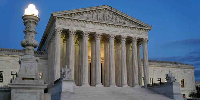 Light illuminates part of the Supreme Court building at dusk on Capitol Hill in Washington, Nov. 16, 2022.