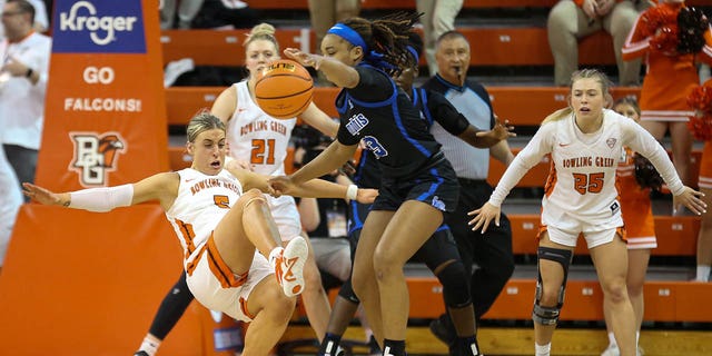 Bowling Green Falcons guard Elissa Brett (5) tries to draw a charging call against Memphis Tigers guard Jamirah Shutes (23) during a third-round game in the Women's National Invitational Tournament March 23, 2023, at the Stroh Center in Bowling Green, Ohio. 