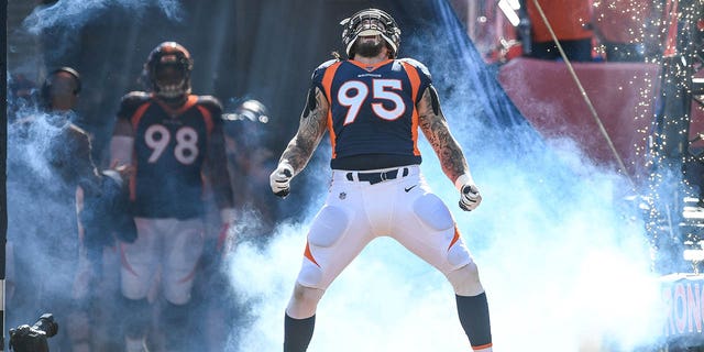 Derek Wolfe, #95 of the Denver Broncos, runs onto the field during starting defense player introductions before a game against the Tennessee Titans at Empower Field at Mile High on October 13, 2019, in Denver, Colorado. 