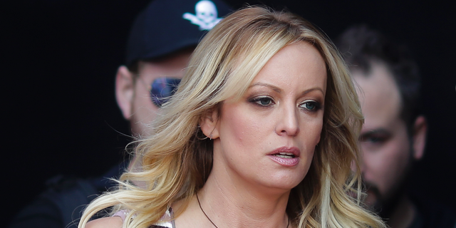 In this Oct. 11, 2018, file photo, adult film actress Stormy Daniels arrives for the opening of the adult entertainment fair "Venus," in Berlin.  (AP Photo/Markus Schreiber, File)