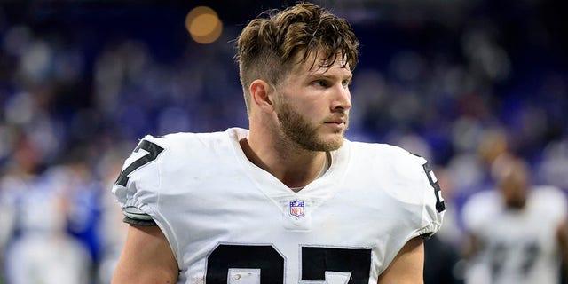 Foster Moreau of the Las Vegas Raiders walks off the field after a win over the Indianapolis Colts at Lucas Oil Stadium Jan. 2, 2022 in Indianapolis.