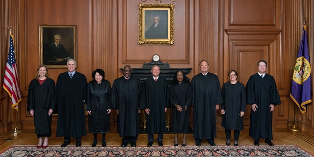 Members of the Supreme Court, from left to right, Associate Justices Amy Coney Barrett, Neil M. Gorsuch, Sonia Sotomayor, and Clarence Thomas, Chief Justice John G. Roberts, Jr., and Associate Justices Ketanji Brown Jackson, Samuel A. Alito, Jr., Elena Kagan, and Brett M. Kavanaugh pose in the Justices Conference Room.