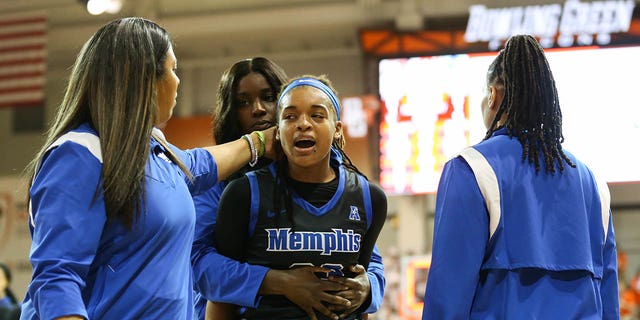 Memphis Tigers guard Jamirah Shutes (23) is escorted off of the court after an altercation with Bowling Green Falcons guard Elissa Brett (not pictured) on March 23, 2023 at the Stroh Center in Bowling Green, Ohio.