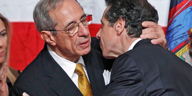 Democratic gubernatorial candidate Andrew Cuomo, right, hugs his father Mario after winning election for New York governor Nov. 2, 2010. 