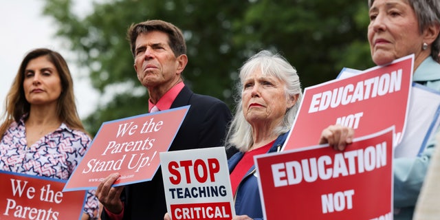 Opponents critical race theory protest outside of the Loudoun County School Board headquarters, in Ashburn, Virginia, on June 22, 2021.