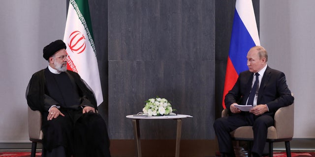 Russian President Vladimir Putin meets with Iranian President Ebrahim Raisi on the sidelines of the Shanghai Cooperation Organization (SCO) summit in Samarkand, Uzbekistan, Sept. 15, 2022. Iran's Presidential Website/WANA (West Asia News Agency)/Handout via Reuters)