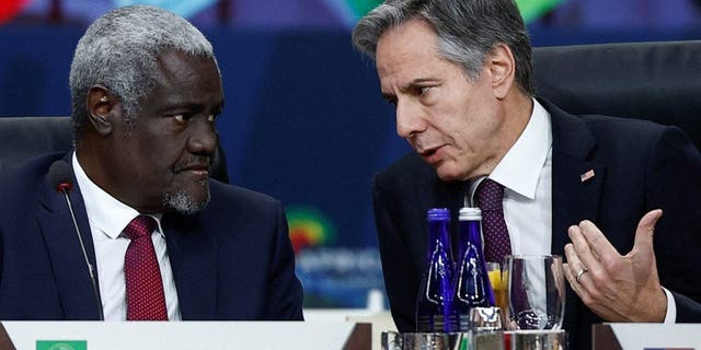 U.S. Secretary of State Antony Blinken speaks with African Union Commission (AUC) Chairperson Moussa Faki Mahamat during the working lunch on multilateral cooperation at the U.S.-Africa Leaders Summit, in Washington, U.S., December 15, 2022. REUTERS/Evelyn Hockstein