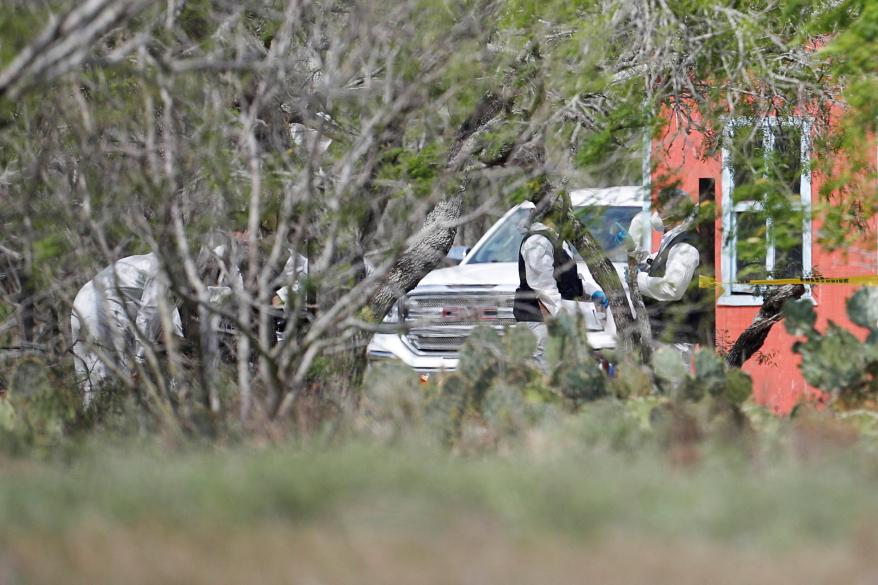 Forensic technicians work at the scene where authorities found the bodies of two of four Americans kidnapped by gunmen, in Matamoros, Mexico.