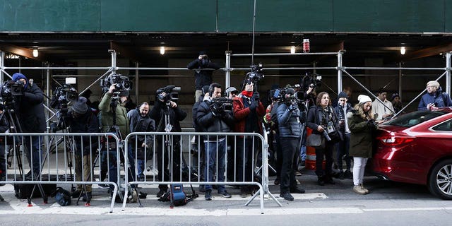 Members of the media gather after former U.S. President Donald Trump's indictment by a Manhattan grand jury following a probe into hush money paid to porn star Stormy Daniels, in New York City, U.S., March 30, 2023.  