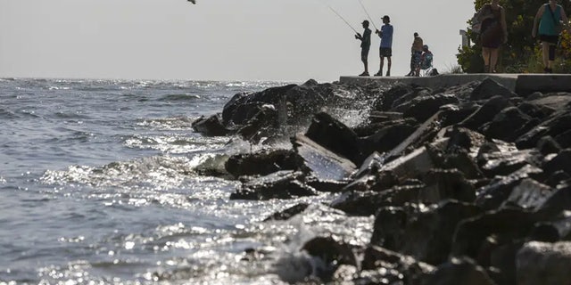 Fisherman are seen along the jetty at John's Pass Thursday, Feb. 23, 2023 in Madeira Beach, Fla. 