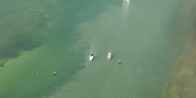 Red tide is observed at Clearwater Beach, Fla., during a flight with SouthWings volunteers on Friday, March 10, 2023. 