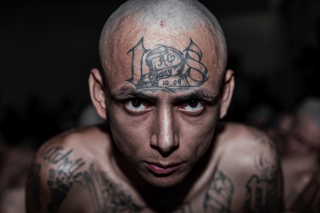 An inmate is pictured during the second arrival of inmates belonging to the MS-13 and 18 gangs to the new prison "Terrorist Confinement Centre" (CECOT) in Tecoluca on March 15, 2023.