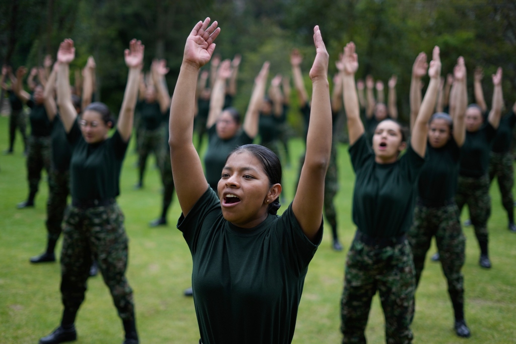 Female voluntary recruits practice routines during a three month training program at a military base in Bogota, Colombia on March 6, 2023.