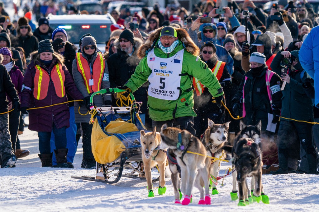 Ryan Redington mushes down Front Street to win the 2023 Iditarod Trail Sled Dog Race on March 14, 2023 in Nome, Alaska. 