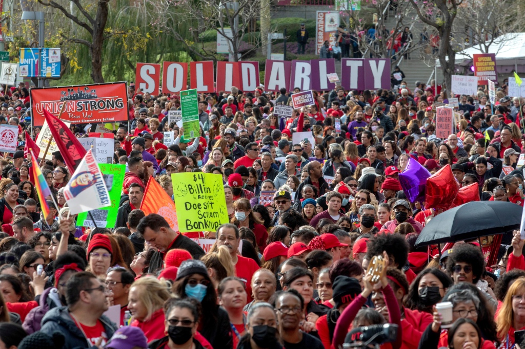 A crowd of Los Angeles Unified School District teachers and Service Employees International Union 99 (SEIU) members gather in Grand Park in front of City Hall on March 15, 2023, in Los Angeles. 