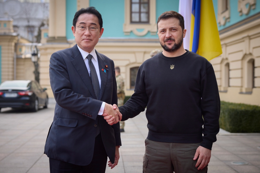 Japanese Prime Minister Fumio Kishida and Ukrainian President Volodymyr Zelenskyy, right, greet each other during their meeting in Kyiv, Ukraine on March 21, 2023.