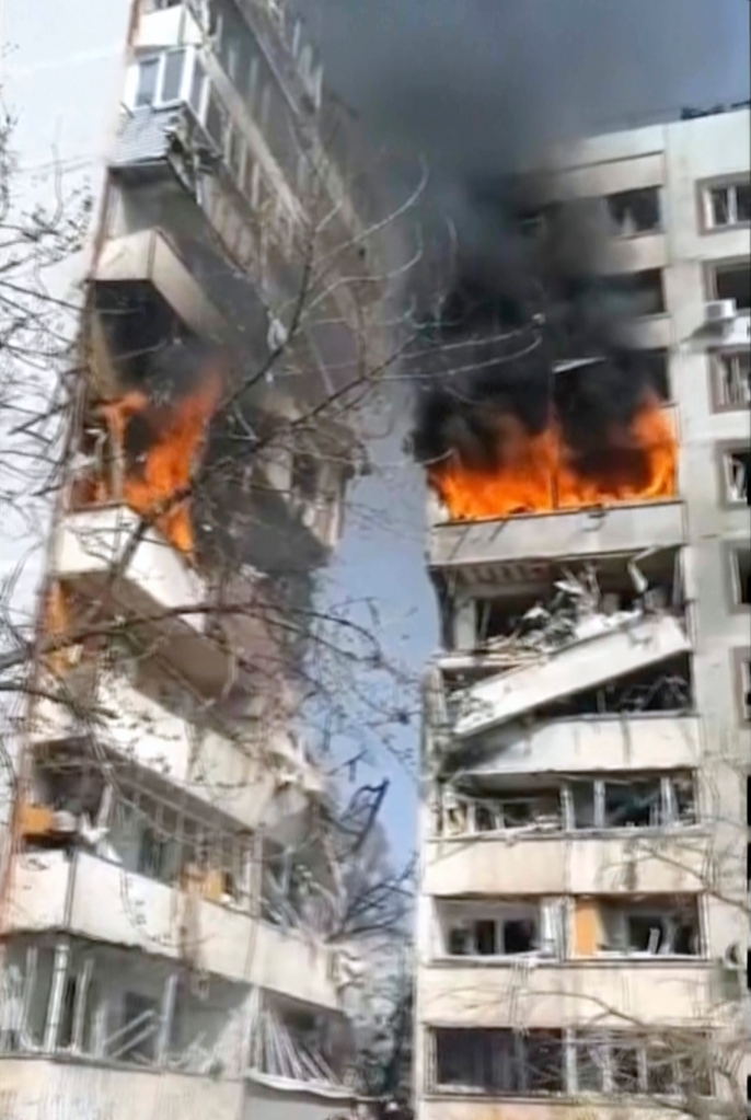 A residential multi-story building hit by a missile is on fire in southeastern city of Zaporizhzhia, Ukraine on March 22, 2023. 