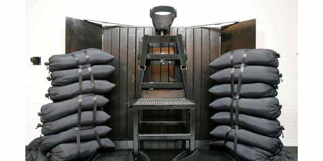 FILE - A chair sits in the execution chamber at the Utah State Prison on June 18, 2010, after Ronnie Lee Gardner was executed by firing squad in Draper, Utah.