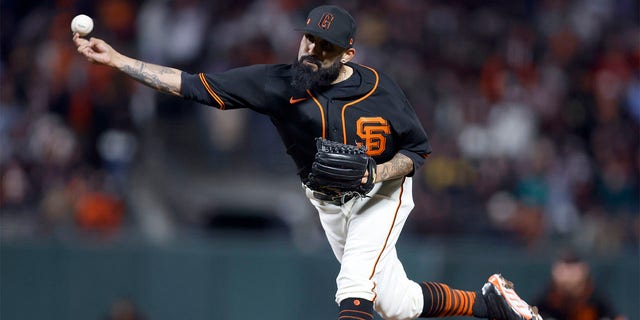 San Francisco Giants pitcher Sergio Romo (54) throws against the Oakland Athletics during the seventh inning of a spring training baseball game in San Francisco, Monday, March 27, 2023. 