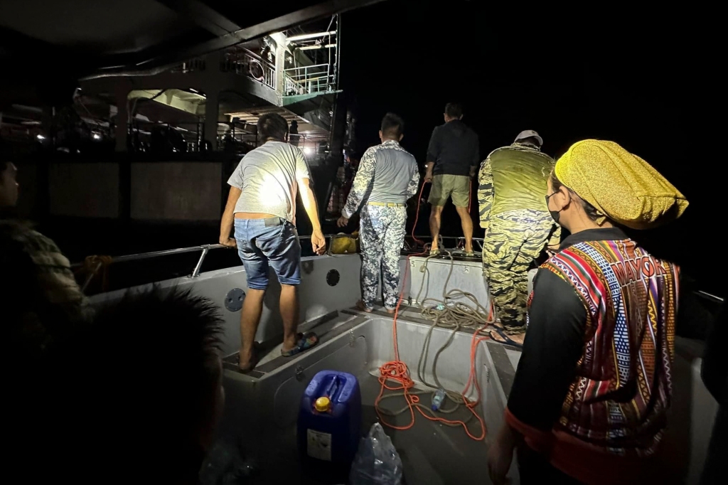 Philippine Coast Guard personnel search for survivors from the fire on MV Lady Mary Joy at Basilan, southern Philippines on March 30, 2023.