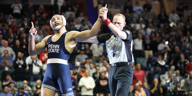 Aaron Brooks, left, after defeating Parker Keckeisen of Northern Iowa in the Division I Mens Wrestling Championship held at the BOK Center on March 18, 2023 in Tulsa, Oklahoma.