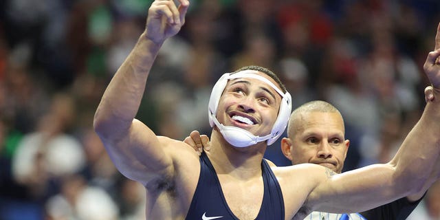 Aaron Brooks celebrates after winning by decision over Trent Hidlay of NC State during the Division I Mens Wrestling Championship held at the BOK Center on March 17, 2023 in Tulsa, Oklahoma.